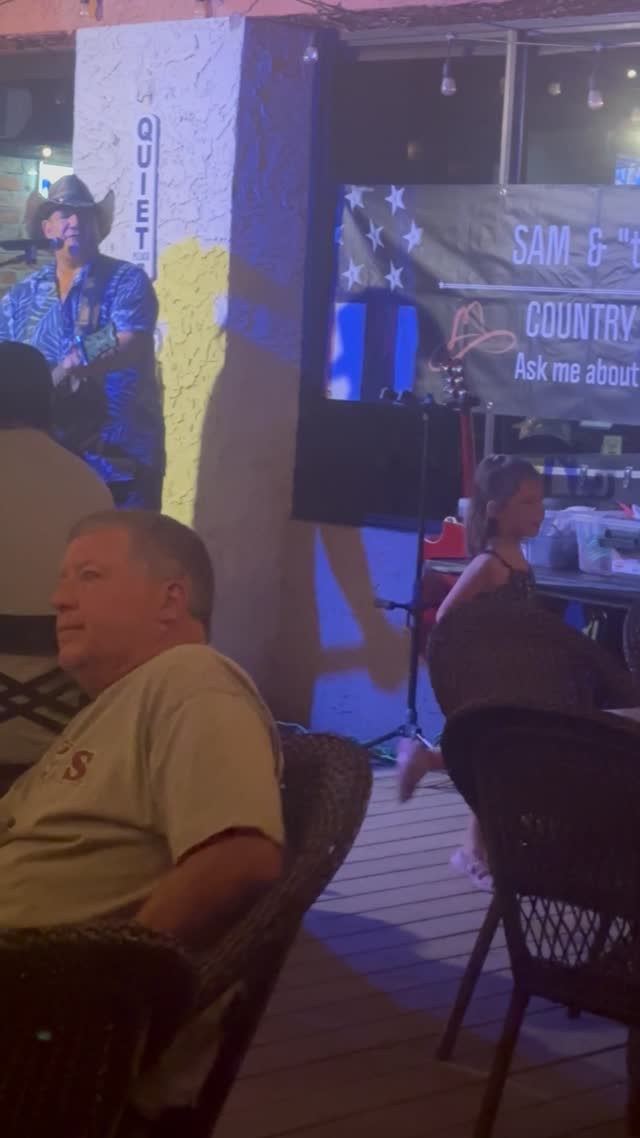Sam performing and audiences enjoying live music